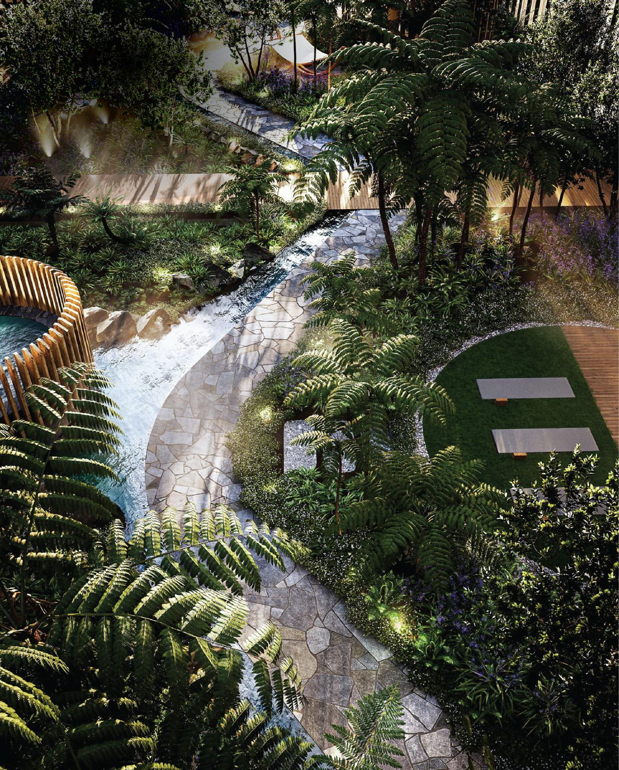 Tropical resort-inspired garden with greenery and a winding landscape walkway